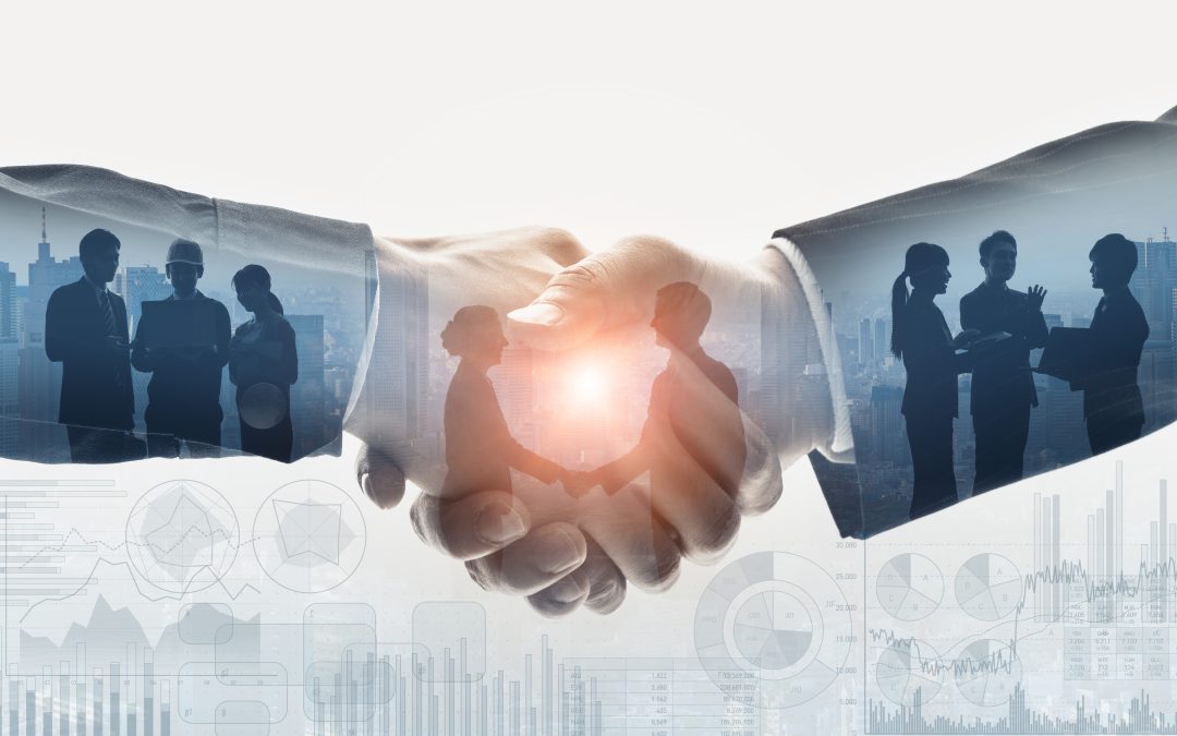Two hands shaking, with silhouettes of business people and charts superimposed, symbolizing partnership and teamwork.
